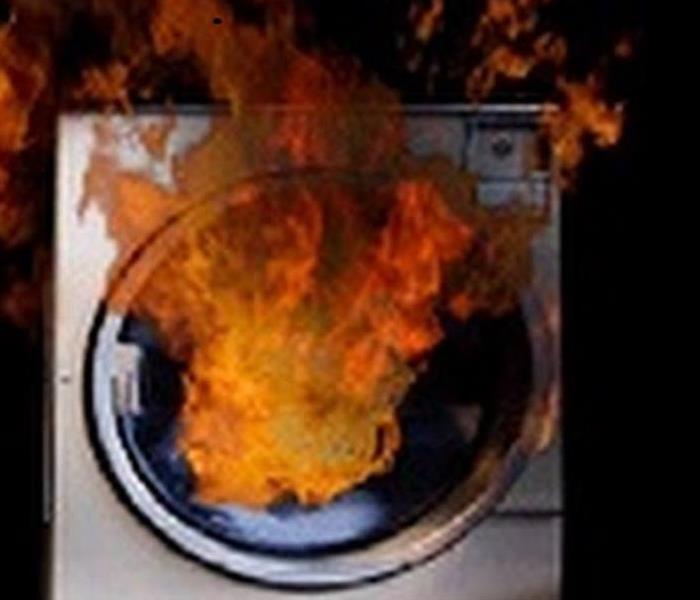 white dryer with flames shooting out