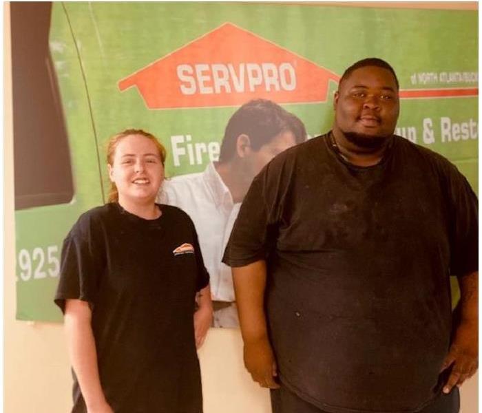 employee photo, female and male, SERVPRO backdrop